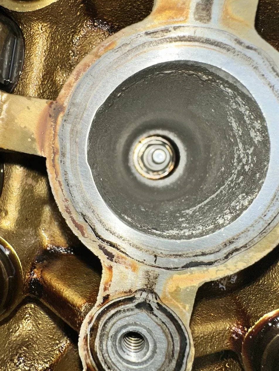 Close inspection of a cylinder head during an engine service